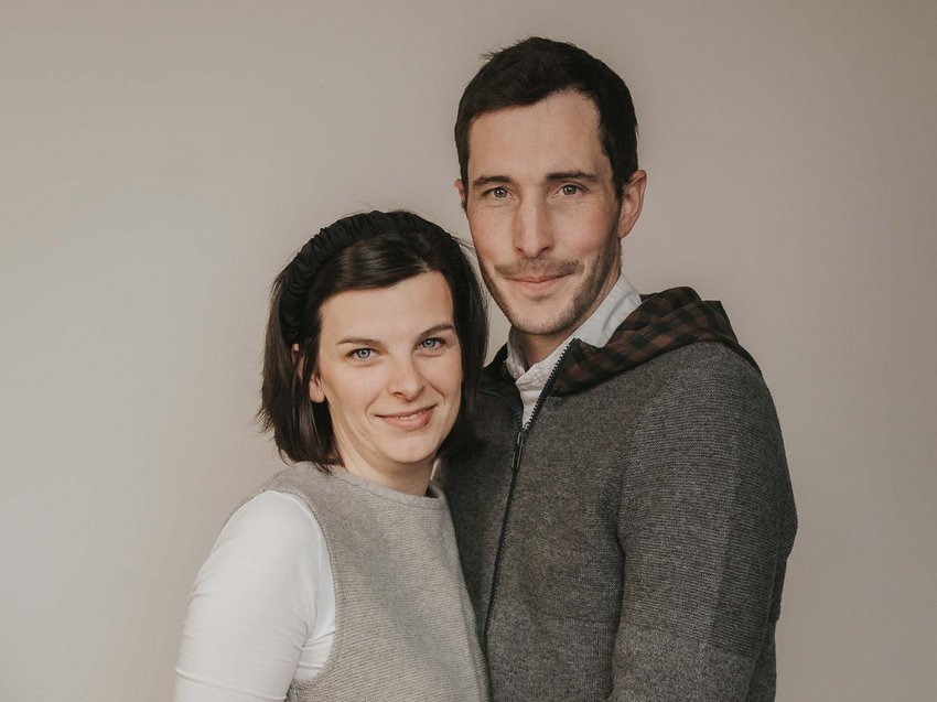 Get away from it all and relax at our chalet in Stubaital Couple smiling and hugging in front of a light grey background